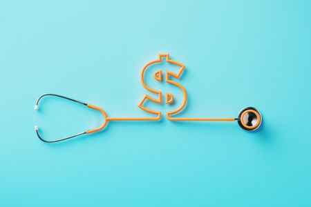rendering of a stethoscope with a dollar sign on it