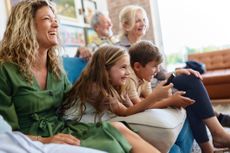 a family streaming on a couch