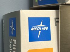 close-up of blue Medline logo on a cardboard box